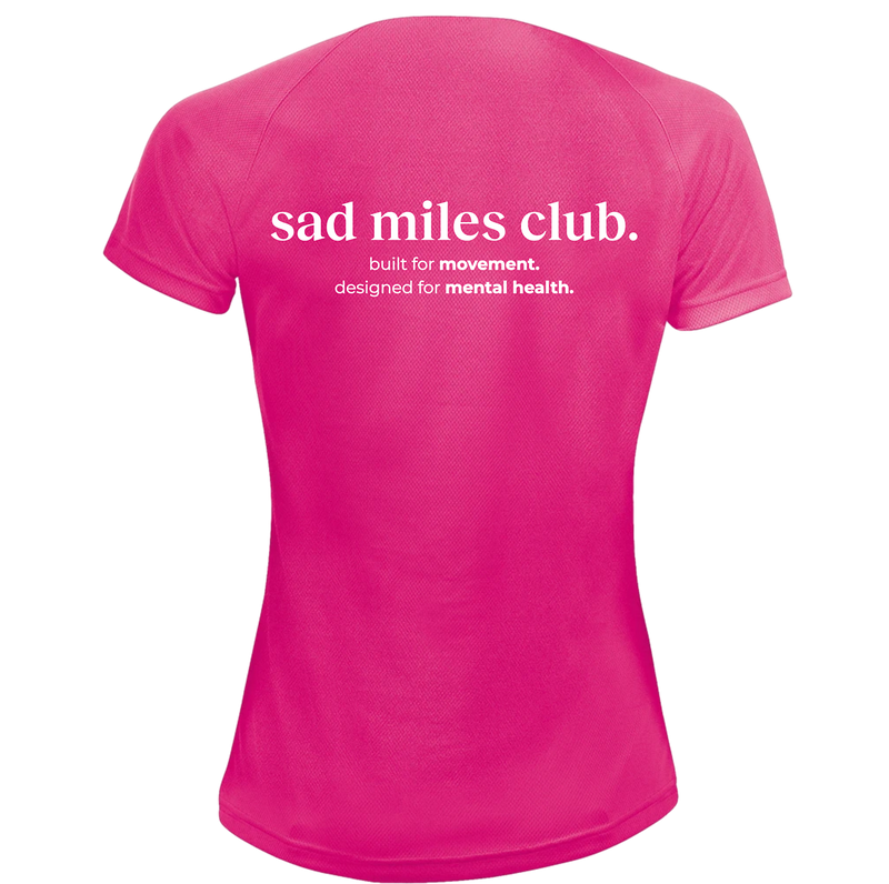 Pink t-shirt with 'sad miles club' text on a white background