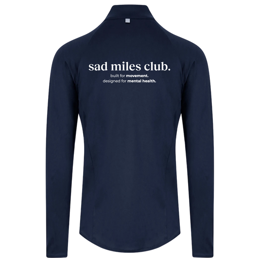 Navy long-sleeve shirt with 'sad miles club' text on a white background