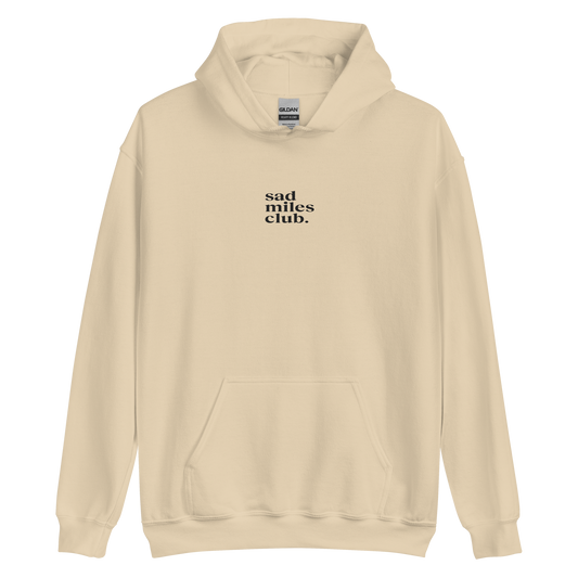 White hoodie with a small logo and text on a white background
